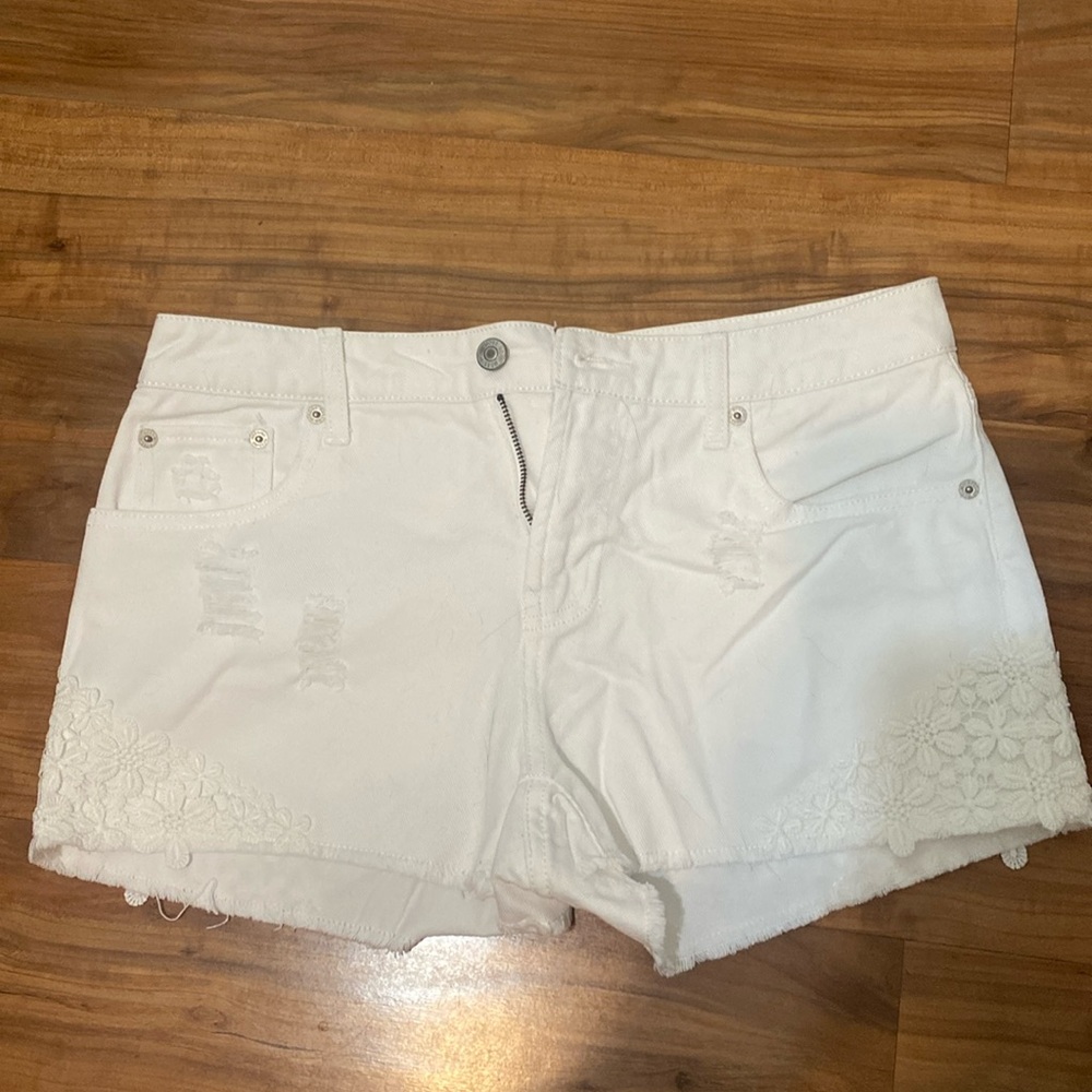 Mossimo white denim shorts with flower pattern on the edge